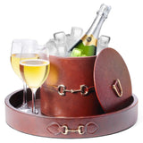 Faux leather ice bucket with lid on side, gold-tone chain latch, holds champagne glasses.