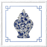 Framed Chinoiserie wall décor featuring a lidded blue and white temple