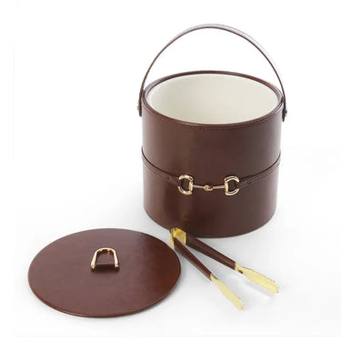 Faux leather ice bucket with lid and side tools, gold-tone latch, curved carrying handle.