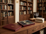 Black mahjong tiles and burgundy case styled for a relaxed morning game in a bright breakfast nook