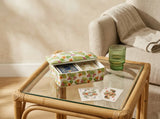 Closed Palm Garden ceramic playing card box decorated with green leaves and coral and pink tropical flowers