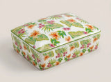 ivory and navy botanical playing card decks arranged inside the divided ceramic storage box