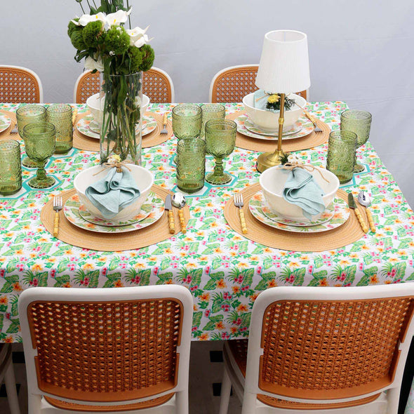 Tropical floral dining set featuring vibrant placemats, dinner plates, and napkins, perfect for stylish table settings, home dining, or entertaining guests. Bright and colorful tropical patterns add a lively and elegant touch to any dining table