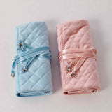 Jewelry roll organizer available in soft blue and blush pink colors
