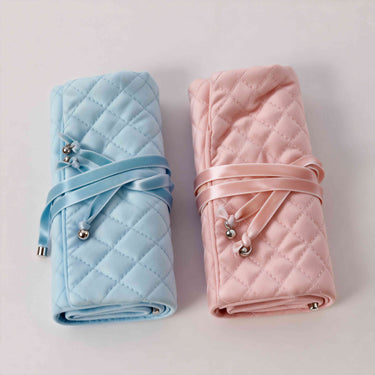 Jewelry roll organizer available in soft blue and blush pink colors