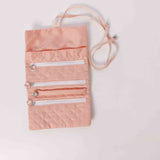 Jewelry roll organizer available in soft blue and blush pink