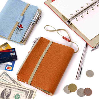 Compact travel notebook wallet with floral embroidery on vegan pebble leather