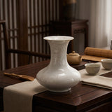 Side view of handcrafted crystalline flat-belly vase showing dynamic glaze patterns