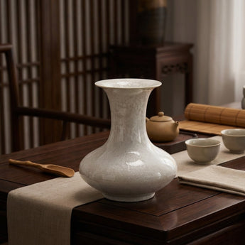 Side view of handcrafted crystalline flat-belly vase showing dynamic glaze patterns
