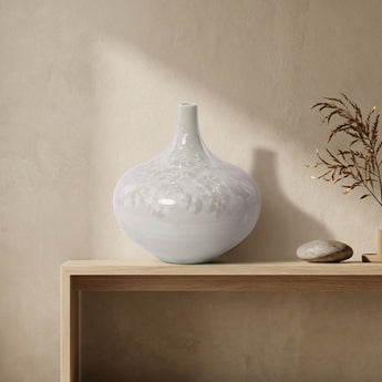 Side view of handcrafted crystalline flat-belly vase showing dynamic glaze patterns