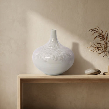 Side view of handcrafted crystalline flat-belly vase showing dynamic glaze patterns