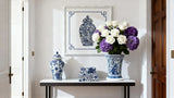 Framed Chinoiserie wall art featuring a blue and white ginger jar