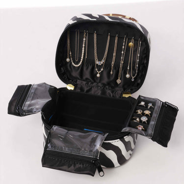 Zippered closure detail on leopard print vegan leather jewelry pouch