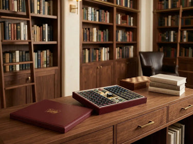 Black mahjong tiles and burgundy case styled for a relaxed morning game in a bright breakfast nook