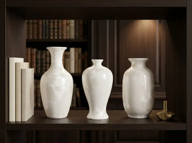 Close-up of translucent crystal formations across the ivory porcelain mini vases