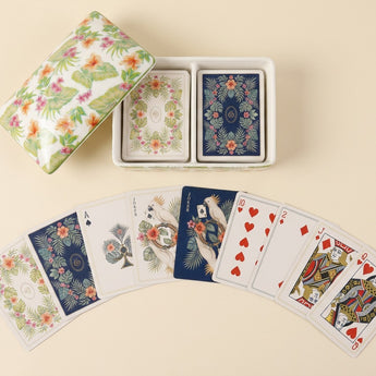 Palm Garden double-deck playing card set displayed with an open tropical floral ceramic box and illustrated cards