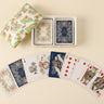 Palm Garden double-deck playing card set displayed with an open tropical floral ceramic box and illustrated cards