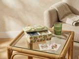 Closed Palm Garden ceramic playing card box decorated with green leaves and coral and pink tropical flowers