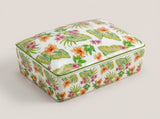  ivory and navy botanical playing card decks arranged inside the divided ceramic storage box