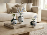 Wisteria Reverie mini bud vase set styled with delicate single stems and small flower clippings.