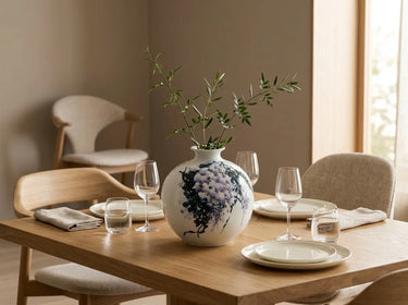 wisteria Reverie hand-painted porcelain vase styled on a dinner table